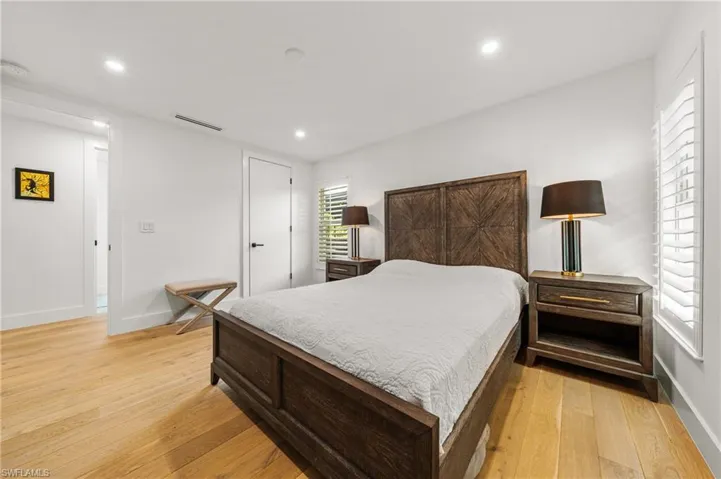 Bedroom with light hardwood / wood-style floors