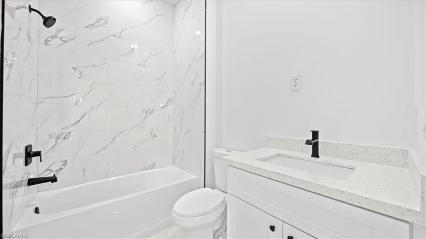 Full bathroom with vanity and tub / shower combination