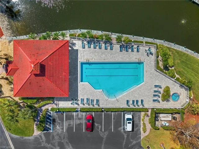 Featuring the beautiful club house with the pool