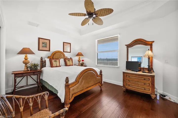 Beautiful Guest Bedroom with ceiling fan, crown molding, a tray ceiling, comfortable wood-style floors and again: Natural light!