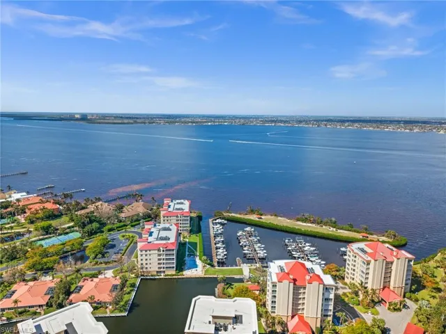 Birds eye view of property with a water view