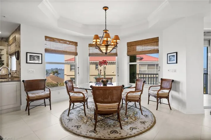 Tiled dining area with views, views, views!  Notice the raised ceiling, and a wealth of natural light!