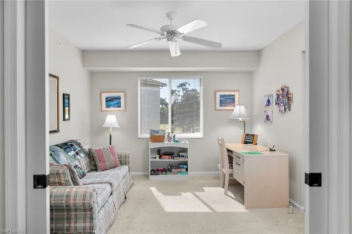 Office area featuring ceiling fan and carpet floors