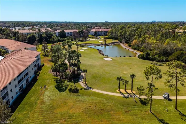 Bird's eye view of a nearby body of water and a golf course