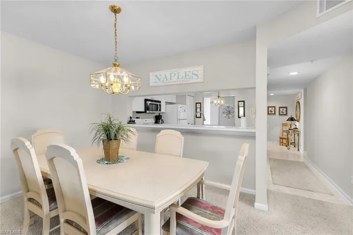 Dining room featuring suspended lighting and baseboards