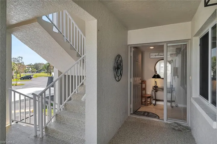 View of exterior entry featuring stucco siding
