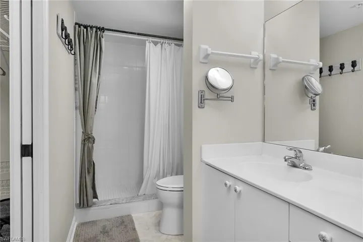 Bathroom featuring vanity and a stall shower