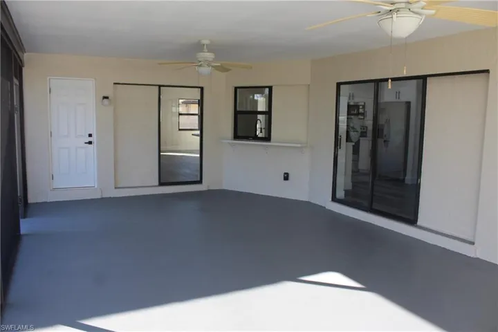 View of patio with ceiling fan and sink