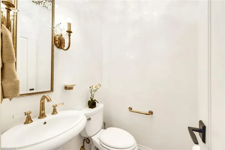 First Floor Powder Bath, with Custom Floor-to-Ceiling Venetian Plaster