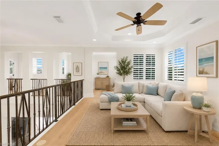 Digitally staged open loft area. Currently staged in home as an office.