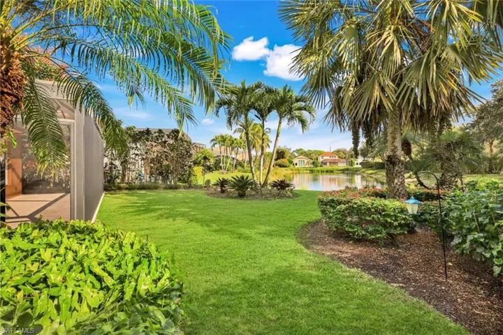 A tropical Oasis, with thoughtful landscaping to enhance the stunning lake view