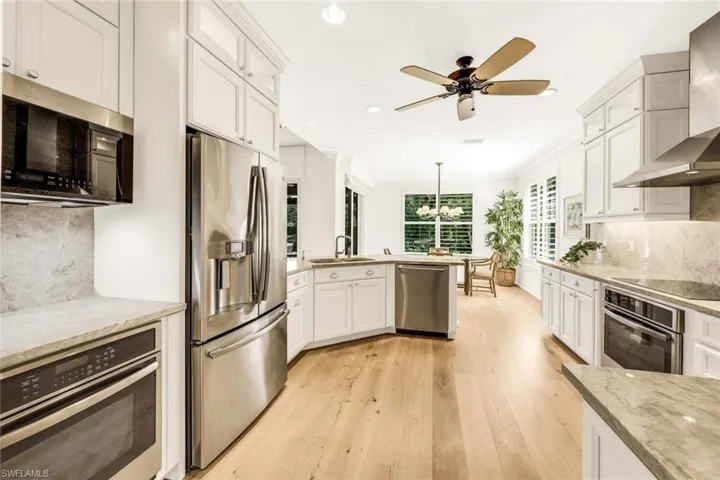 Professional grade GE Profile Appliances w/ double ovens and soft close custom cabinetry