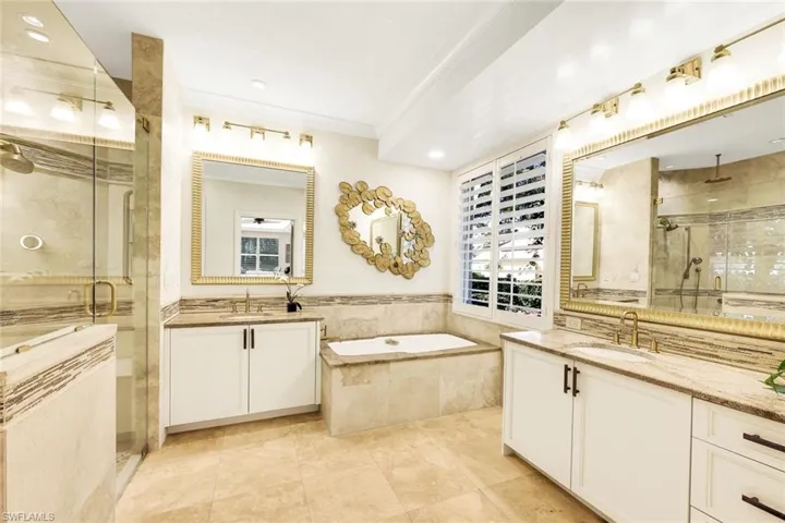 Primary bathroom with walk-in shower and tub. Double vanities and beautiful designer touches.