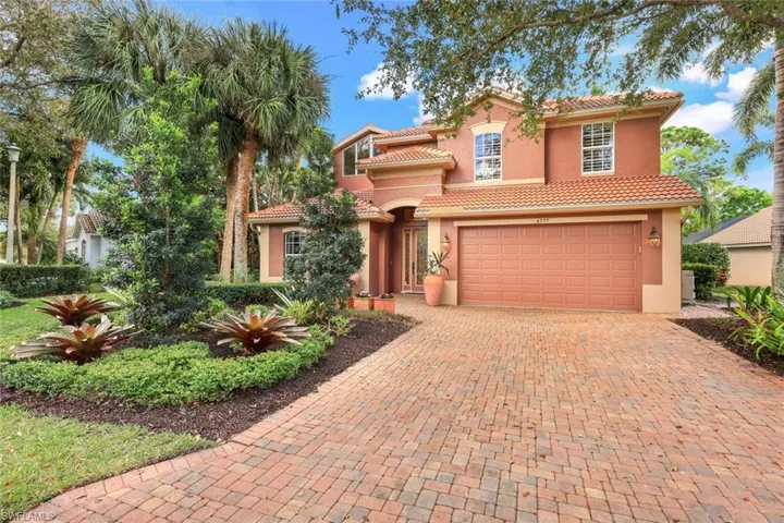 Great Curb Appeal... lush landscaping, brick paver driveway and fresh exterior paint