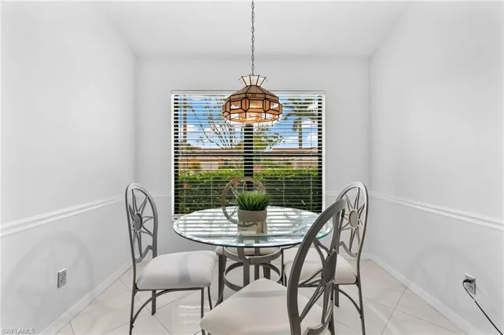 Happy, Delightful Breakfast Room with Picture Window and beautiful Skies
