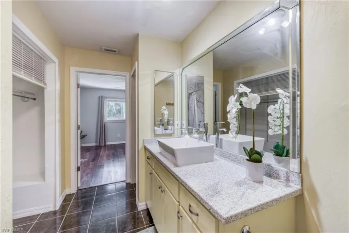Bathroom featuring vanity and hardwood / wood-style floors