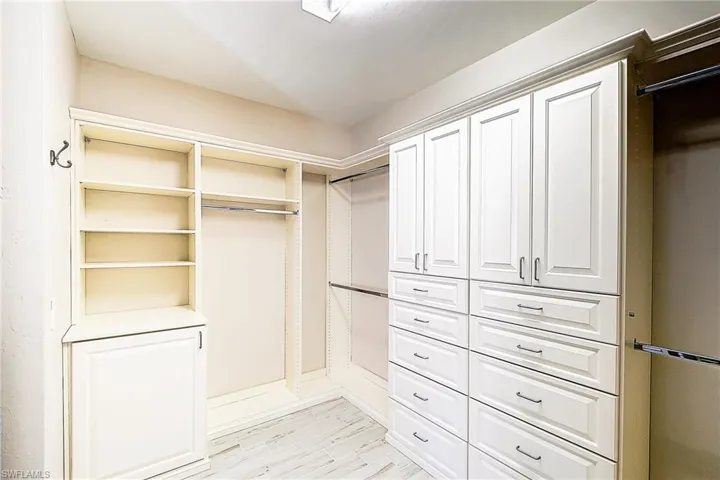 Walk in closet featuring light hardwood / wood-style floors
