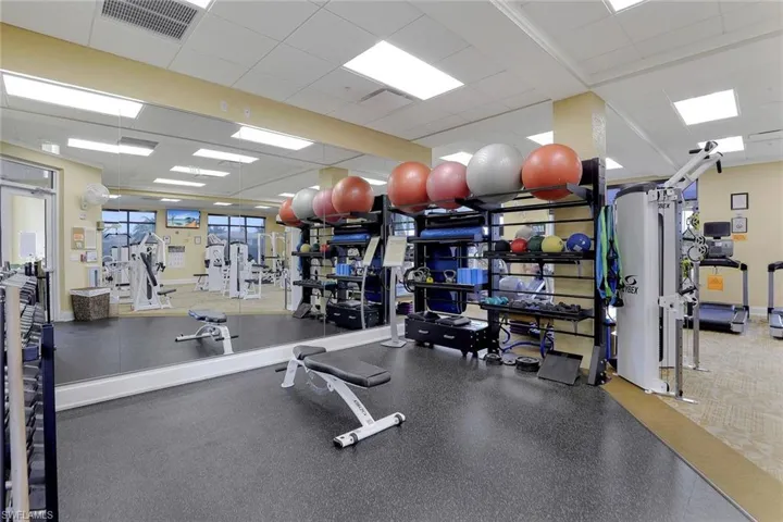Workout area with a paneled ceiling
