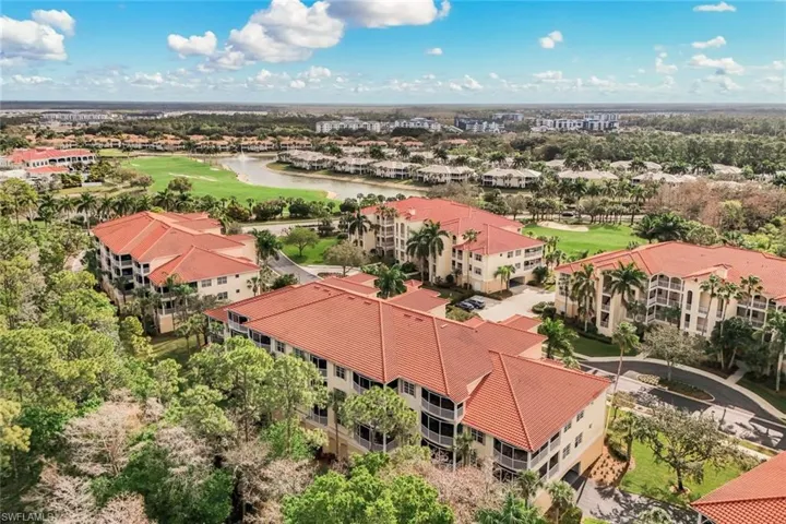 Drone / aerial view of a large body of water and a local golf course