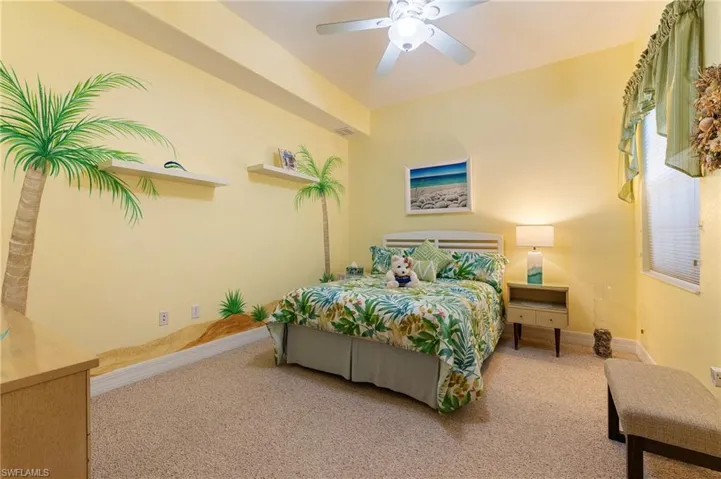 Bedroom with carpet and a ceiling fan