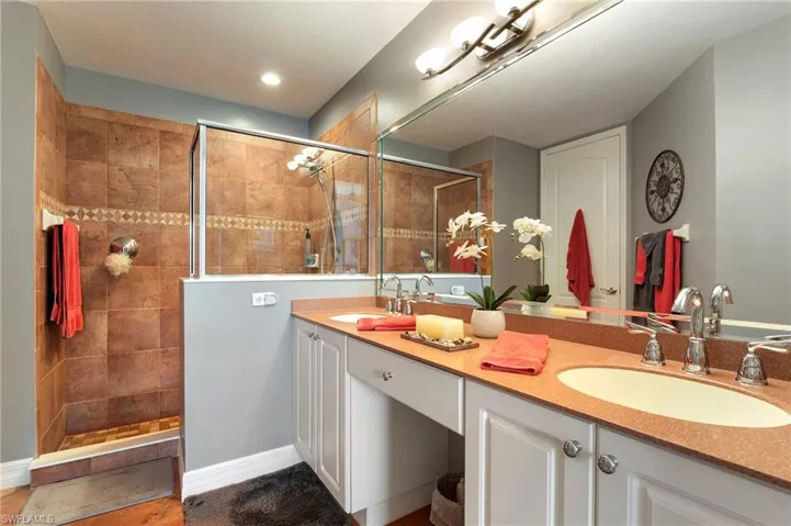 Full bath with double vanity and walk in shower