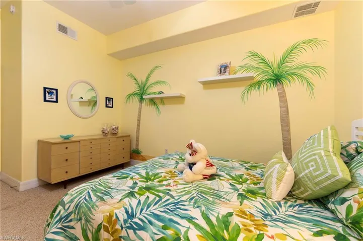 Carpeted bedroom with baseboards