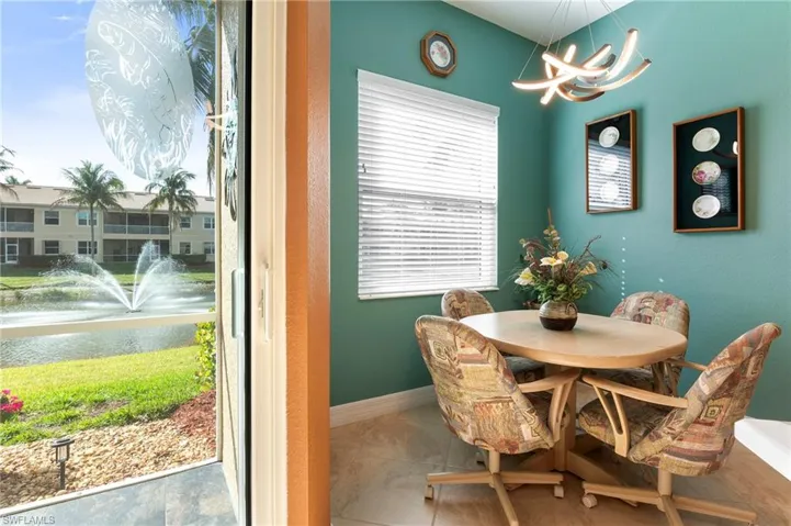 Dining area featuring a chandelier and a water view