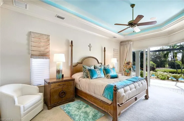 Private primary suite with sliders to lanai