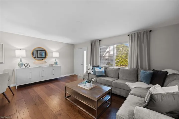 Living room featuring dark wood-type flooring
