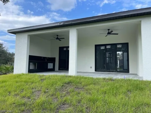 Entrance to property with ceiling fan