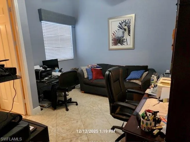 Office area with light tile patterned floors
