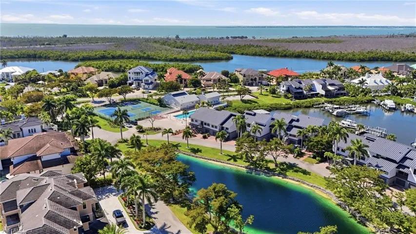 Aerial view of residential area with a nearby body of water