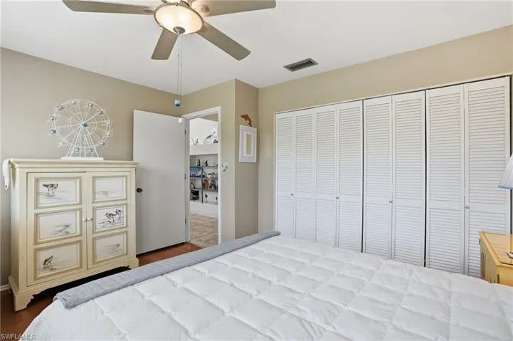 Bedroom featuring a ceiling fan, a closet, and light wood-style floors