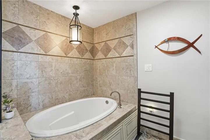 Full bath featuring a garden tub