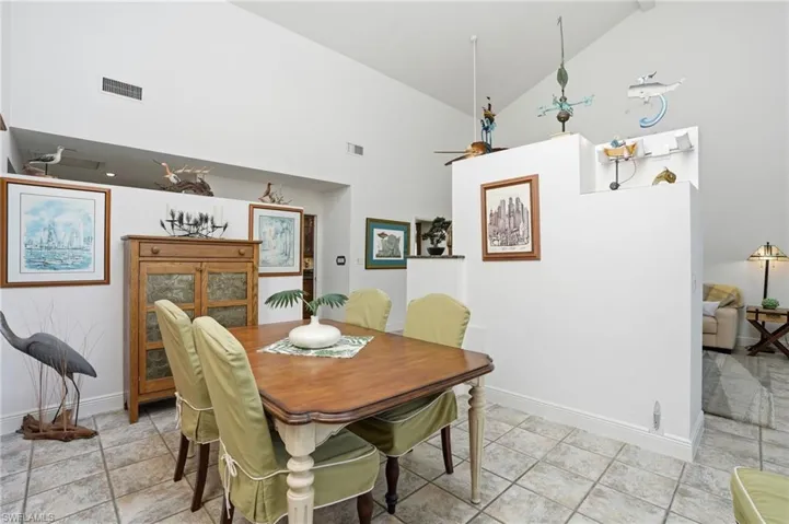 Dining space with lofted ceiling and ceiling fan