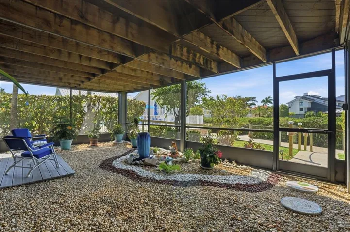 View of yard featuring a sunroom