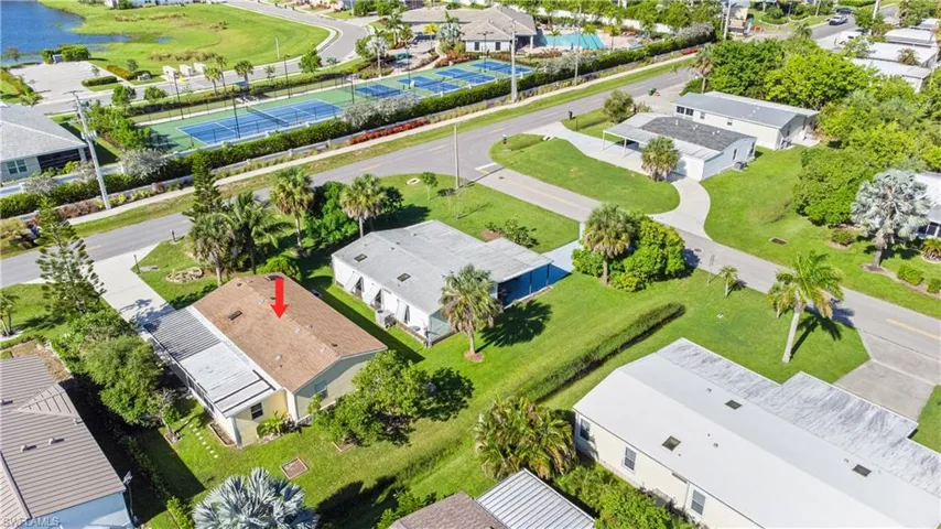 Aerial perspective of suburban area with a large body of water