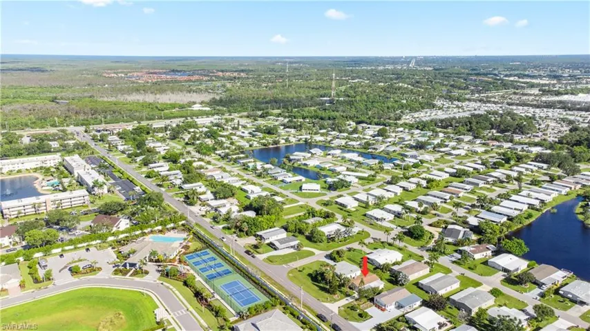 View of property location with a large body of water and nearby suburban area