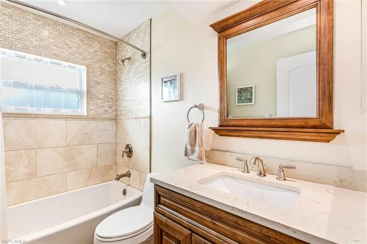Bathroom with vanity and tub / shower combination - Virtually Edited Image