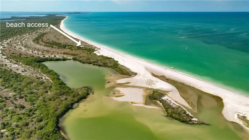 Aerial view with a water view and a beach view