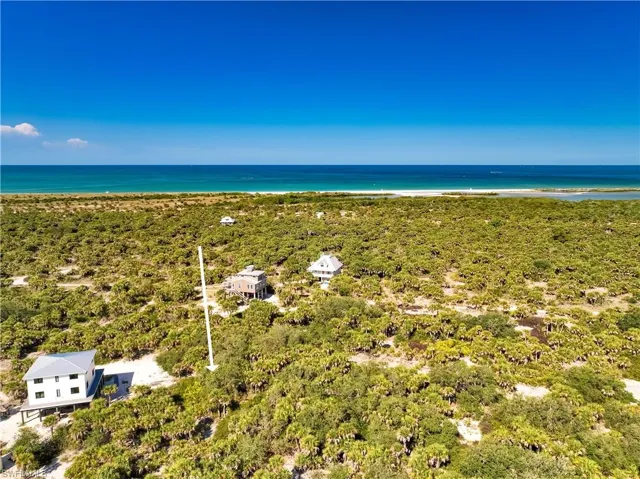 Aerial view with a beach view and a water view
