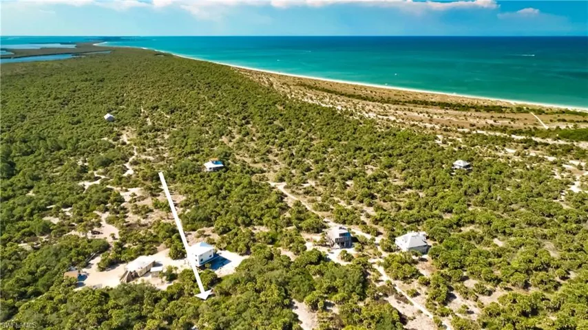 Aerial view with a view of the beach and a water view