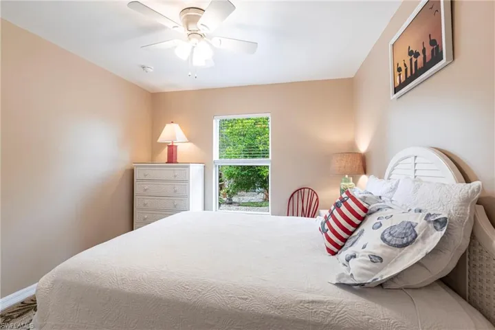 Bedroom with baseboards and a ceiling fan