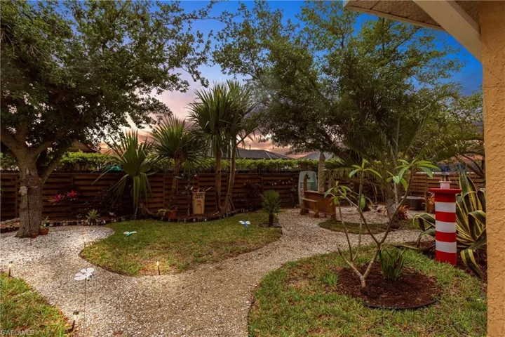 Yard at dusk with fence