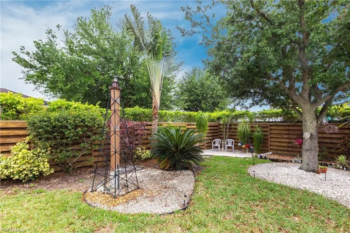 View of yard featuring a fenced backyard and a patio