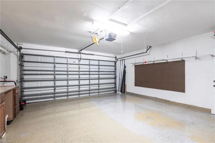 Garage featuring a garage door opener