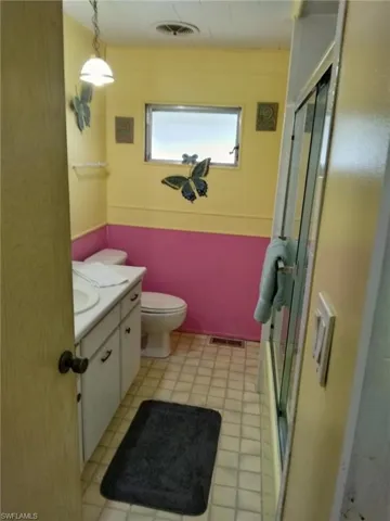 Bathroom with vanity and a stall shower