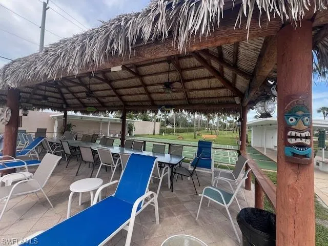 View of patio featuring a gazebo and a ceiling fan