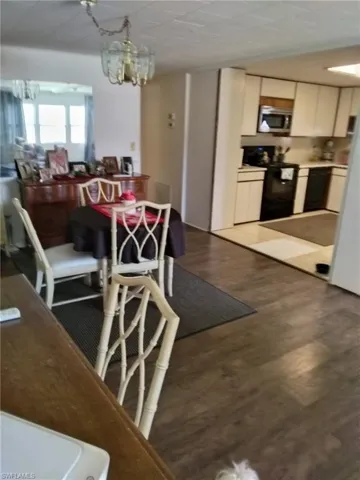 Dining room with a chandelier and wood finished floors