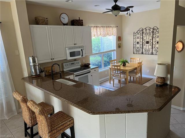 Eat-in kitchen with granite breakfast bar